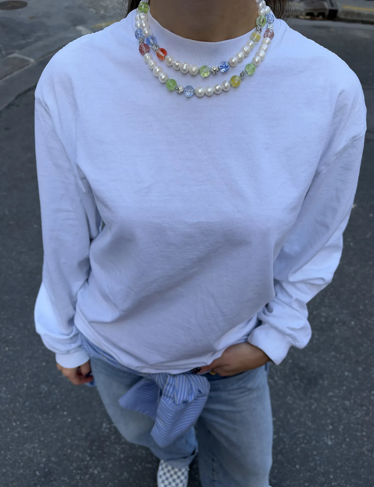 LIZZIE and JIMMY necklaces worn layered with a white tee