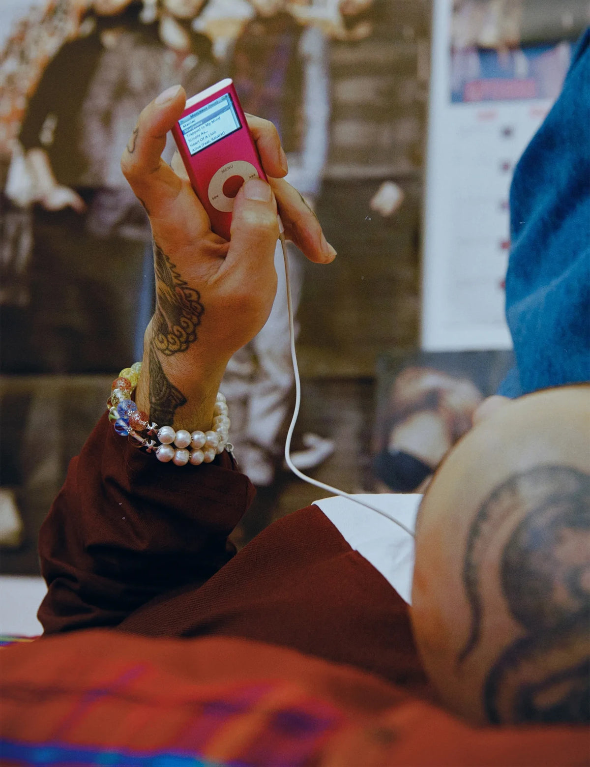DEWEY bracelets worn stacked, holding an MP3 player