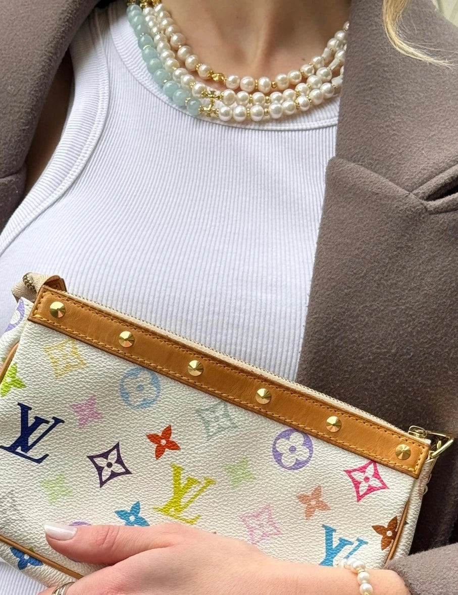 DAÏQUIRI GOLD TIMELESS and GOLD ICE necklaces worn together, white tank top