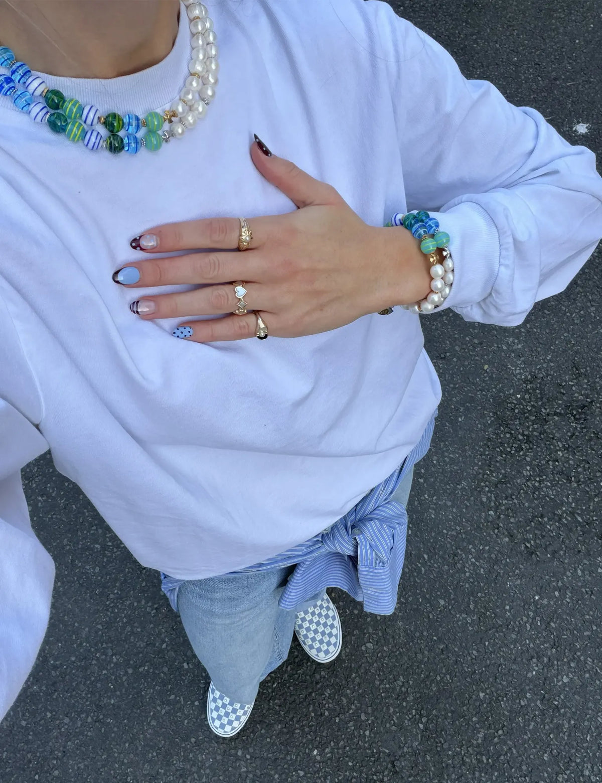 ZACK and ZACK GOLD necklaces worn layered, with ZACK bracelets