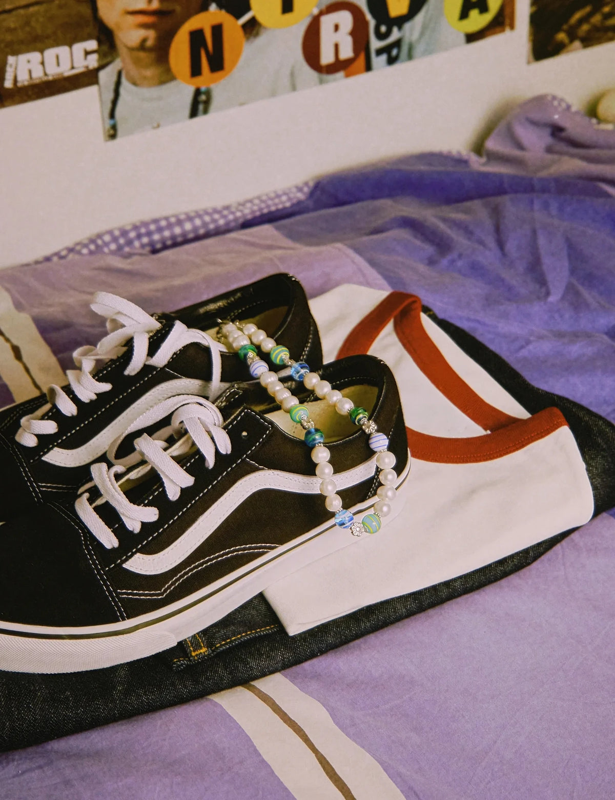 CODY necklace on black sneakers