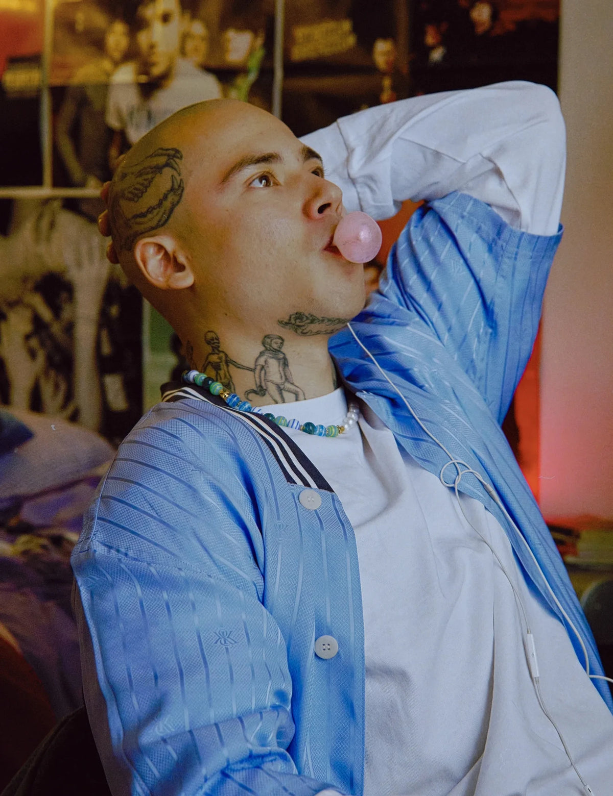 ZACK GOLD necklace worn with a blue striped jacket